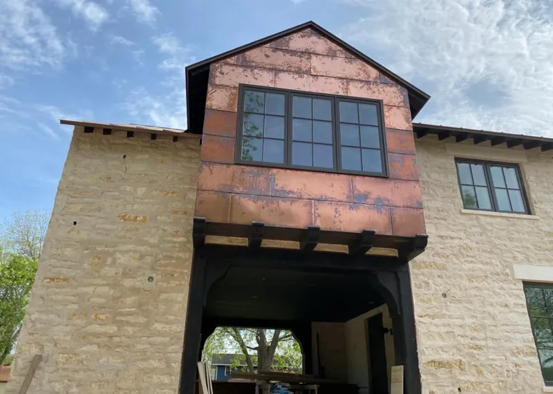 Copper metal panel facade on a stone building for Metal Roof Coating in Union